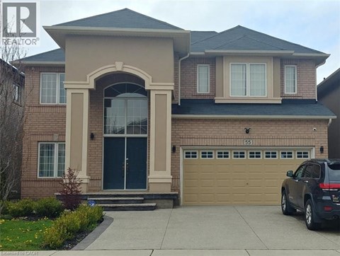 A house with a black car in front.