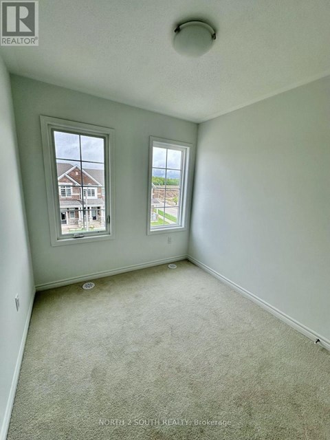 A room with two windows, one facing north and the other south.