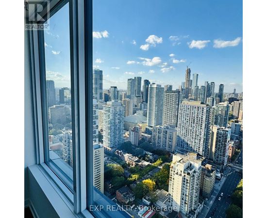 A cityscape is visible through a window.