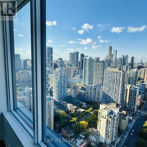A cityscape is visible through a window.