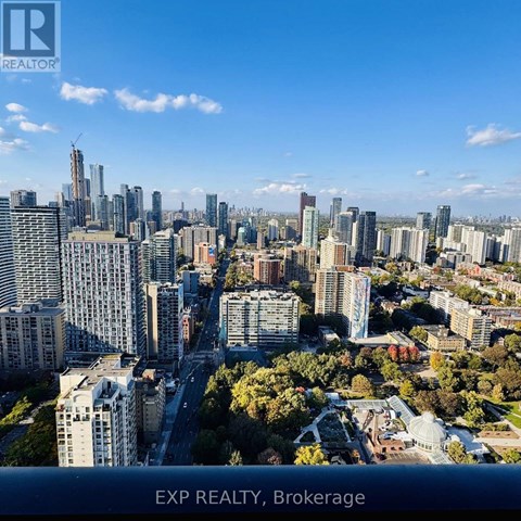 A cityscape with the text "EXP REALTY, Brokerage" at the bottom.
