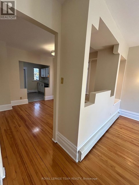 A room with wooden floors and white walls.