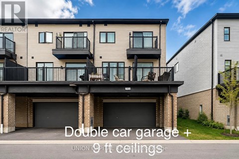 A building with a double car garage and 9 ft ceilings.