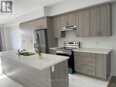A modern kitchen with a white countertop and wooden cabinets.