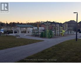 A playground with a slide and swings in a park.