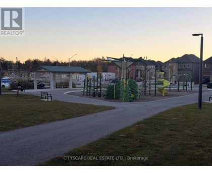 A playground with a slide and swings in a park.