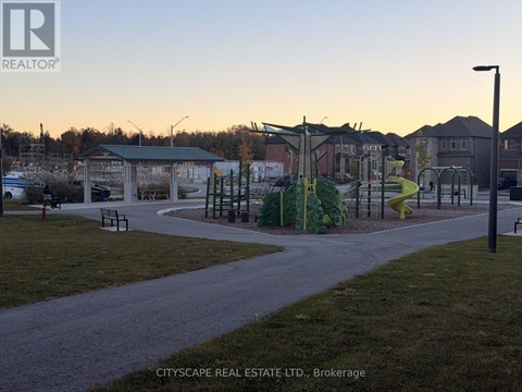 A playground with a slide and swings in a park.