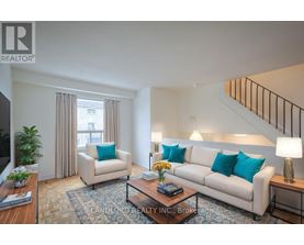 A living room with a couch, chair, and coffee table.