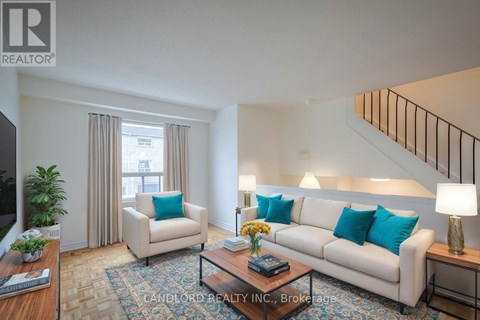 A living room with a couch, chair, and coffee table.