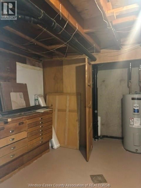 A room with a filing cabinet and a filing system.