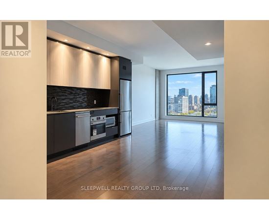A modern kitchen with a view of the city.