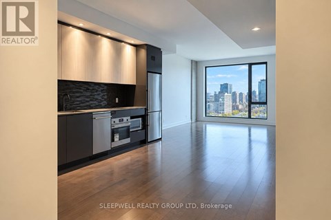 A modern kitchen with a view of the city.