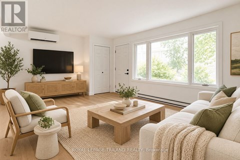 A living room with a couch, chair, and coffee table.