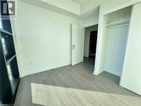 A room with a door and a window.