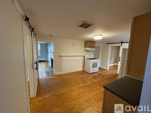 A kitchen area with a stove top oven and a microwave.