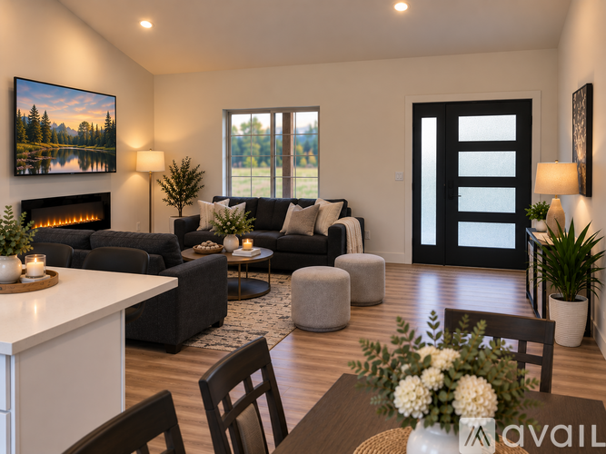 A modern living room with a fireplace and a painting on the wall.