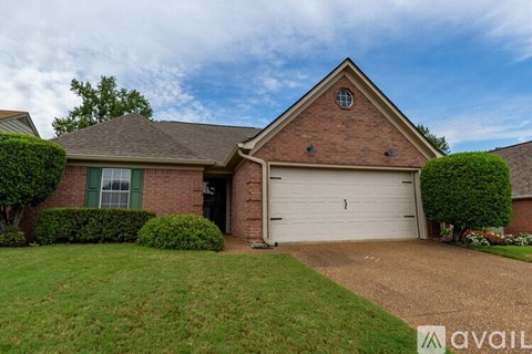 A house with a garage and a driveway.