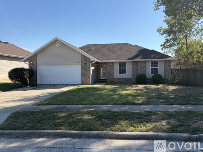 A house with a garage is for sale.