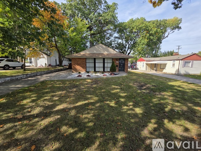 A house with a yard is for sale.