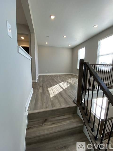 A living room with a staircase leading to the upper floor.