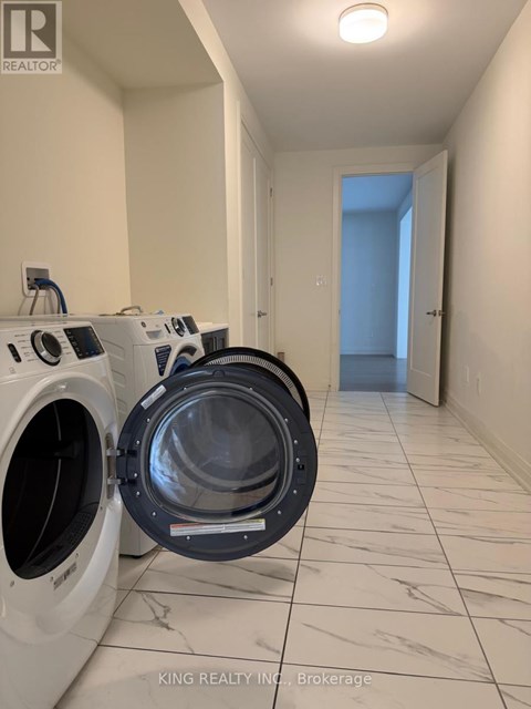 A laundry room with a washer and dryer in it.