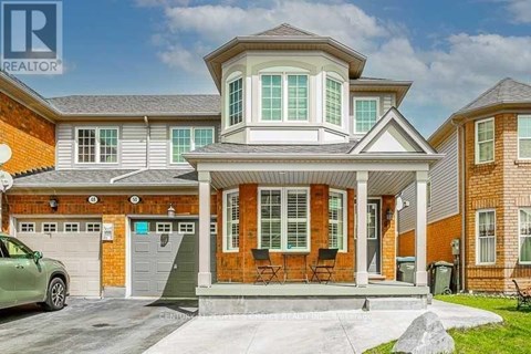A house with a car parked in front of it.