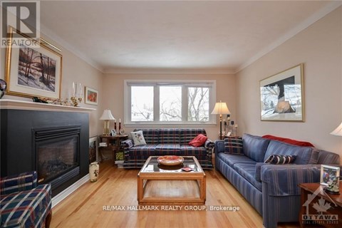 A living room with a fireplace and a couch.