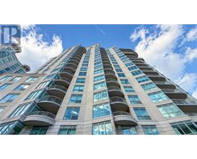 A tall building with balconies on each floor.