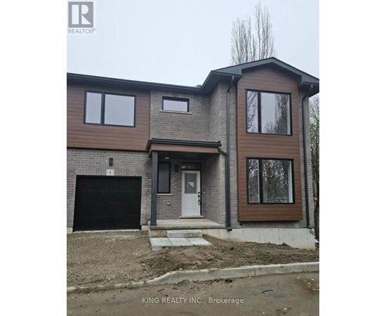 A house under construction with a brown and grey exterior.