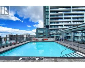 A pool in a residential building with a sign that says "No Swimming".