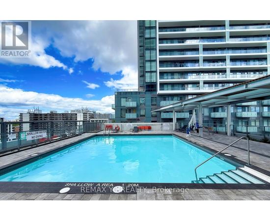 A pool in a residential building with a sign that says "No Swimming".