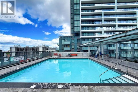 A pool in a residential building with a sign that says "No Swimming".