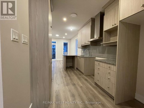 A kitchen with wooden cabinets and a countertop.