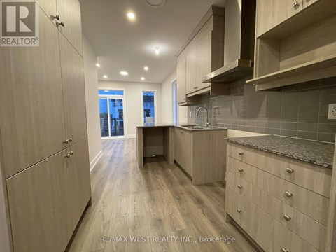 A kitchen with wooden cabinets and a countertop.