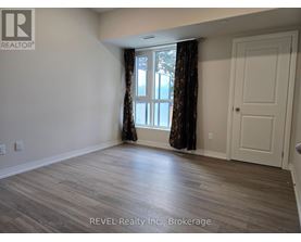 A room with a window and a door is shown in the image.