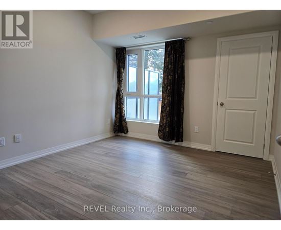 A room with a window and a door is shown in the image.
