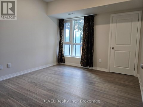 A room with a window and a door is shown in the image.