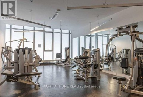 A gym with a variety of equipment is available at this home realty brokerage.