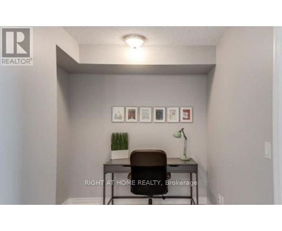 A small room with a desk and a chair.