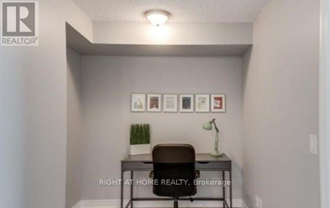 A small room with a desk and a chair.
