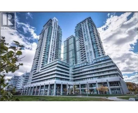 A modern building with two towers is advertised by a realtor.