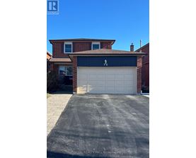 A house with a garage door that has a zigzag pattern on it.