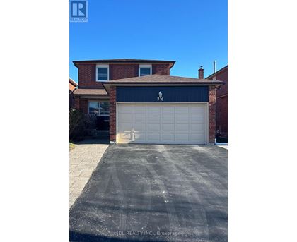 A house with a garage door that has a zigzag pattern on it.