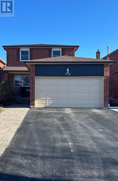 A house with a garage door that has a zigzag pattern on it.