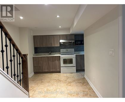 A kitchen with a stove top oven and a microwave.