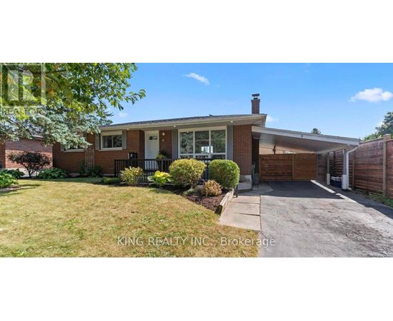A house with a white door and a brick exterior is for sale.