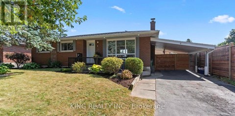 A house with a white door and a brick exterior is for sale.