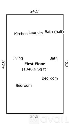 A floor plan of a first floor showing a living area, a bedroom, and a half bath.