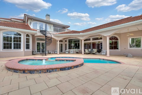 A house with a pool in the backyard.