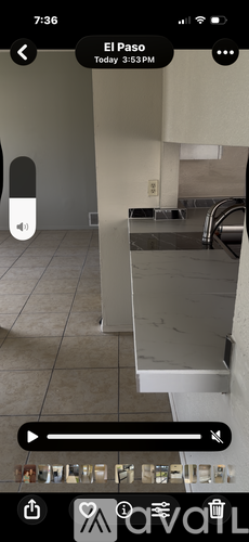 A kitchen with a sink and a counter.